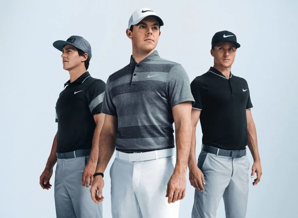 three men wearing visors and fitted golf shirts