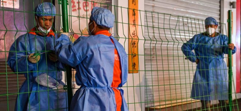 China iPhone workers scale fences and flee factory after it is locked down due to strict COVID policy.
