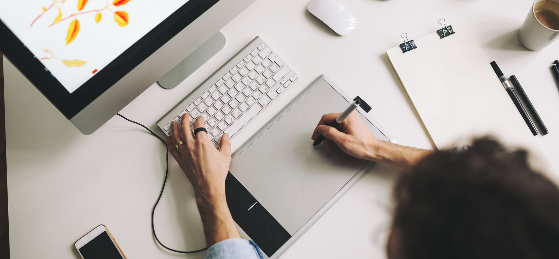 Young graphic designer working in office
