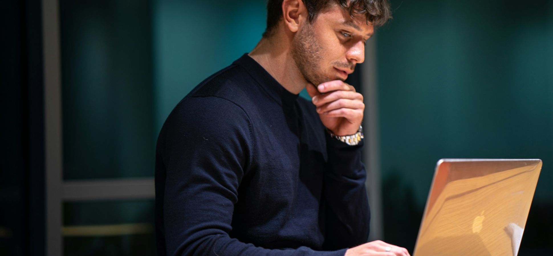 Man working on a laptop.