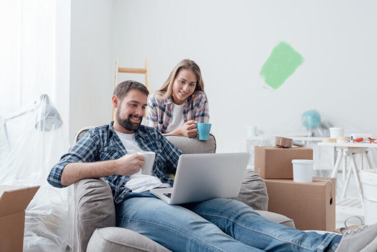 Couple checking updates during home renovation