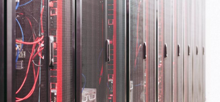 Data center server racks representing the frontier compute the AI slowdown pact targets