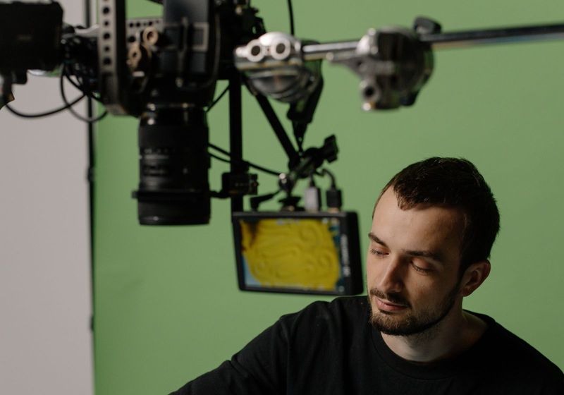 Creator filming branded video content in a studio, the production work an AI brand partnership does not replace