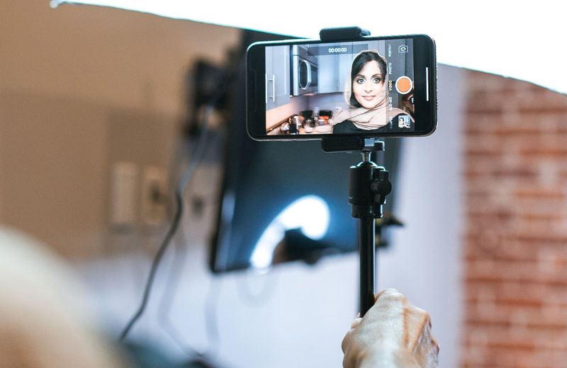 Creator filming short-form video content on a phone for a TikTok creator program