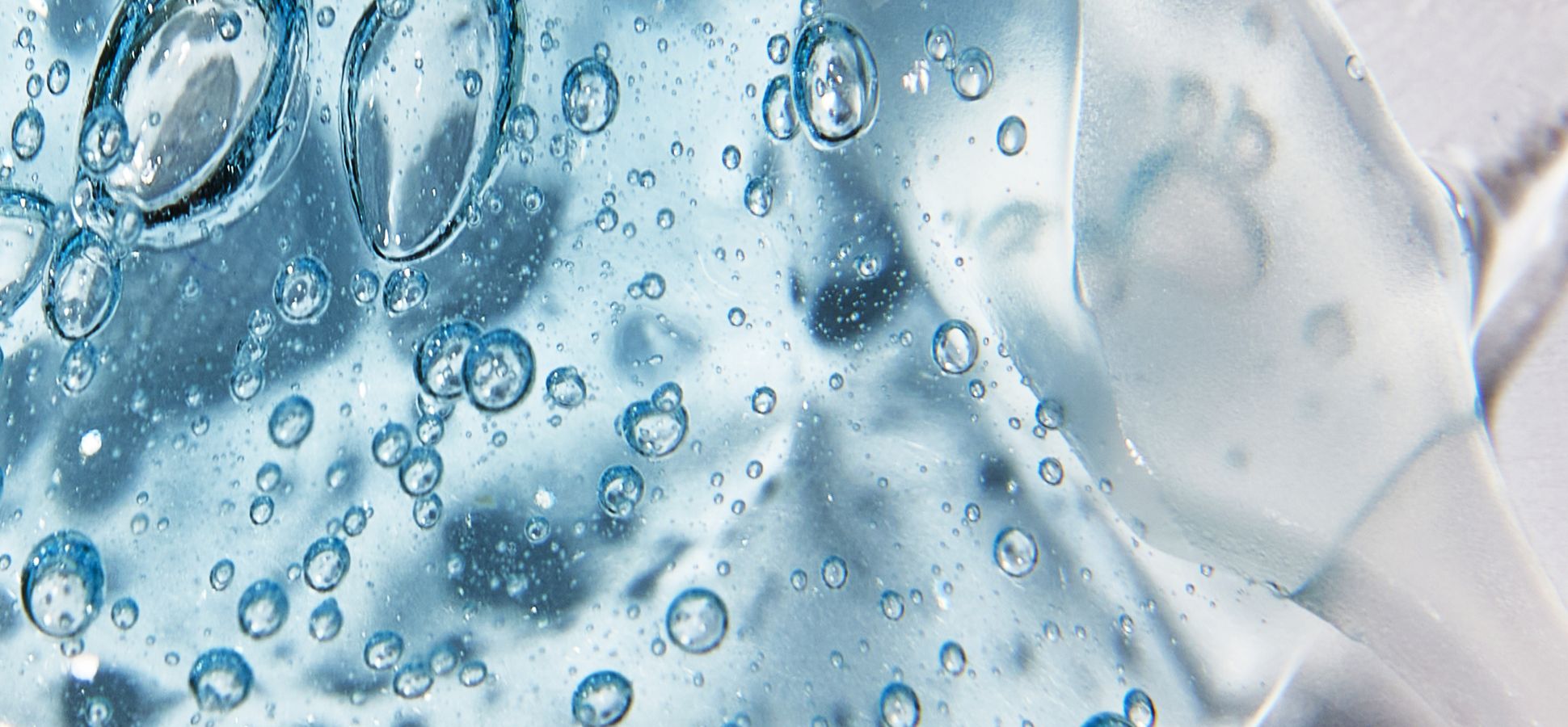 Close-up of clear blue water with small air bubbles