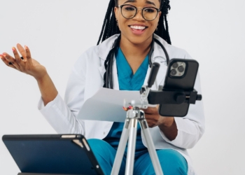 Clinician on a telehealth video consultation, the care model behind celebrities investing in health startups